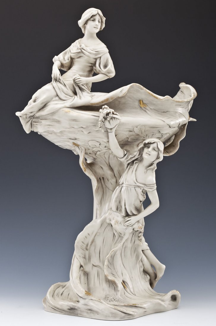 Royal Dux Art Nouveau Figural Compote: DESCRIPTION: Royal Dux figural compote of naturalistic form with two female figures. Marked under base with triangular "Royal Dux Bohemia" mark and stamped "1311" and "39". Late 19th/early 20th centur