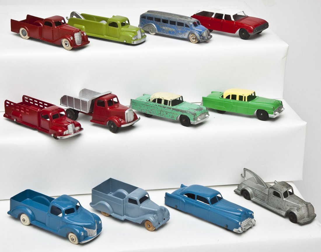 12 Tootsie Toy Vehicles: DESCRIPTION: Twelve Tootsie Toy vehicles including four cars, seven trucks, and one Greyhound bus. MEASUREMENTS: Each 5-1/2-6". CONDITION: Various including restored and unrestored.