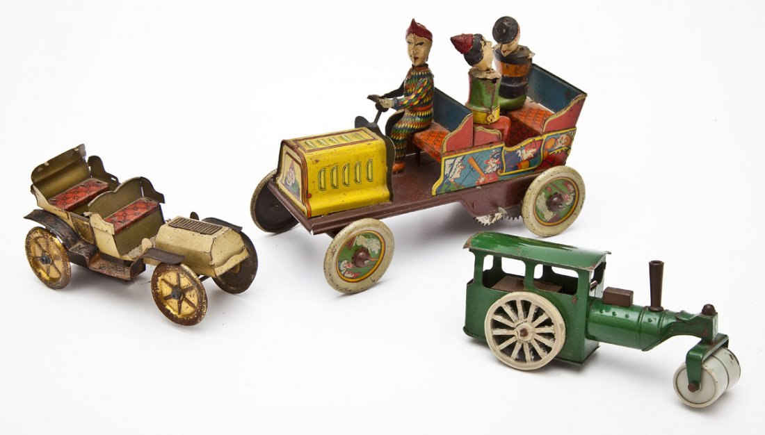 3 Tin Plate Toys incl Eberl Ta-Ra-Ra-Bum: DESCRIPTION: Three tin plate toys: 1) Hans Eberl Ta-ra-ra-bum clown car. Marked Germany. 2) Car. 3) Try-Ang Minic Toys made in England road roller. MEASUREMENTS: 1) 7-1/2" long. 2) 5". 3) 5-1/4". COND