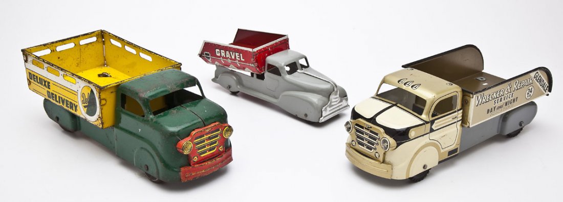 3 Marx Tin Litho Trucks: DESCRIPTION: Three tin litho trucks: 1) Marx Glendale Wrecker & Repair Service. 2) Marx Deluxe Delivery. 3) Marx Sand Dump Truck. MEASUREMENTS: Each 9-11". CONDITION: Sand dump truck body repainted.