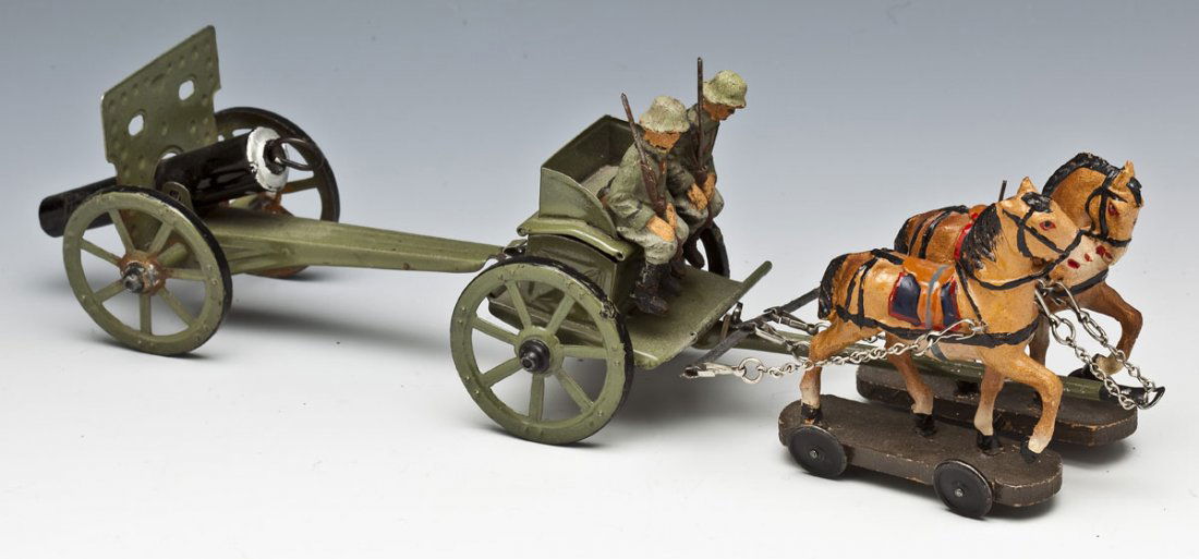 Lineol Horse-Drawn German Field Artillery: DESCRIPTION: Lineol horse-drawn German field artillery, 6.5 cm scale. Limber and cannon are tinplate, toy soldier drivers and horses are composition. Made in 1930's Germany. MEASUREMENTS: 12" long. CO