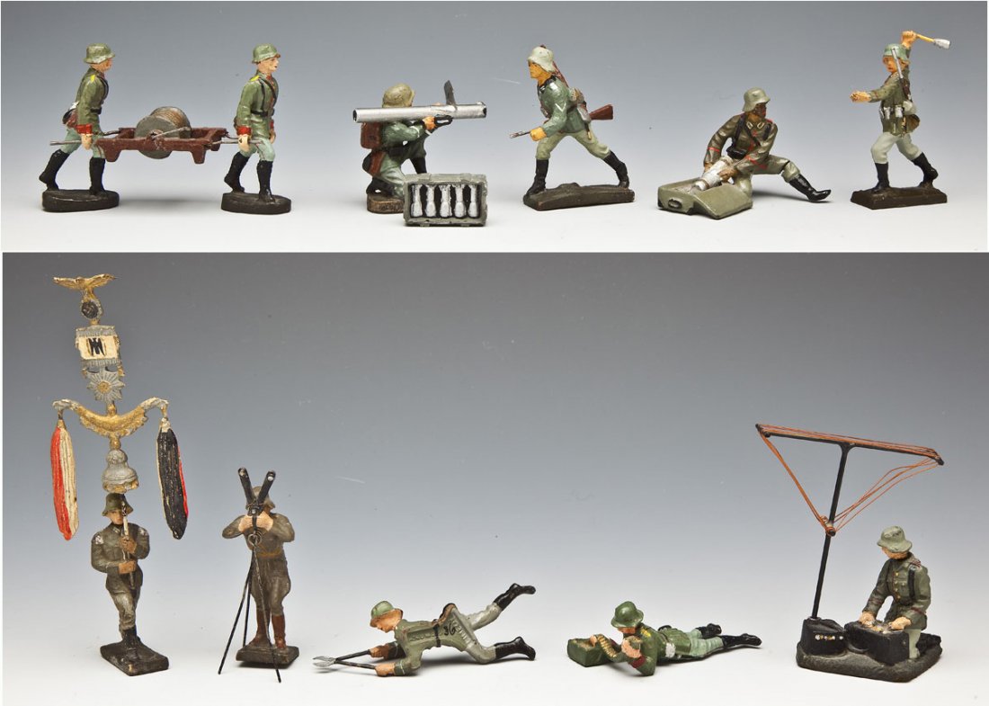 13 Elastolin & Lineol German Toy Soldiers & Accessories: DESCRIPTION: Elastolin and Lineol group of thirteen German Composition toy soldiers in action and accessories. Include rare Lineol musician jingling johnny (Schellenbaum) and Elastolin telephone cable