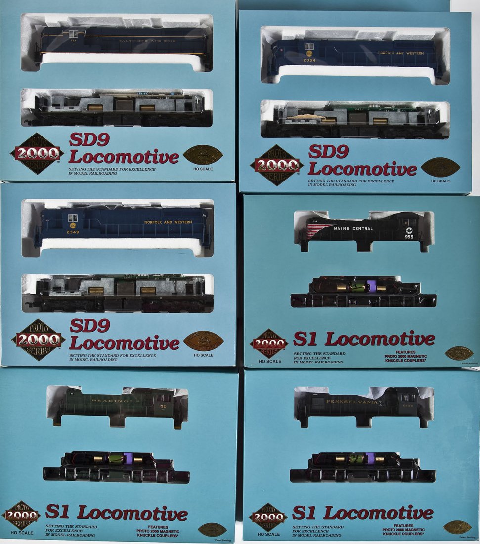 6 Proto 2000 Series Diesel Locomotives: DESCRIPTION: Six Proto 2000 Series diesel locomotives. Including: PRR #5955, MEC #955, RDG #50, N&W #2349, B&O #773, and N&W #2354. CONDITION: Appear unused in original boxes.