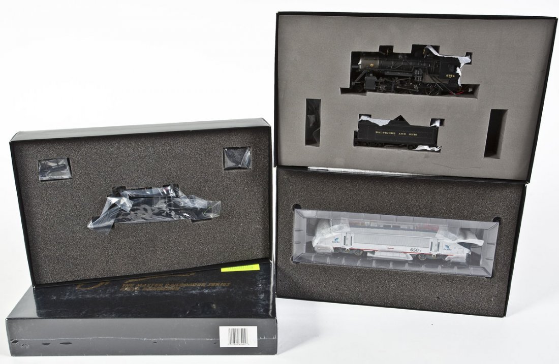 4 Spectrum Locomotives incl Amtrak: DESCRIPTION: Four Spectrum locomotives. Including: B&O #2784, Amtrak #664, Amtrak #650, and Moore Keppel Co. #3. CONDITION: Appear unused in original boxes.
