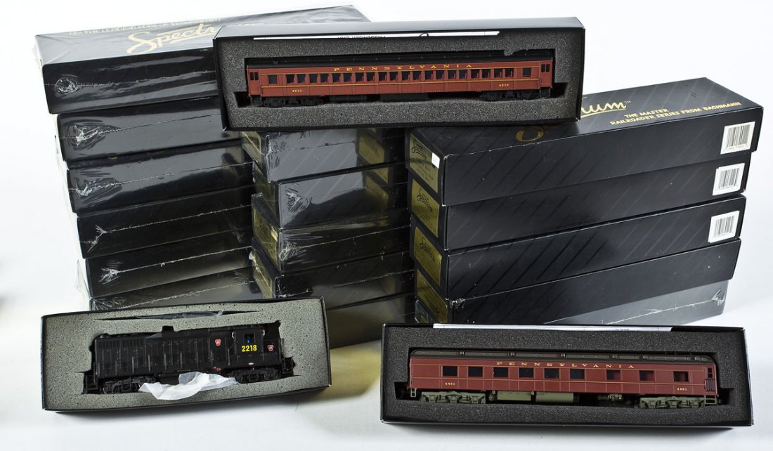 18 Spectrum PRR Passenger Cars & PRR Loco: DESCRIPTION: Eighteen Spectrum PRR passenger cars and one PRR diesel locomotive #8809. CONDITION: Appear unused in original boxes.