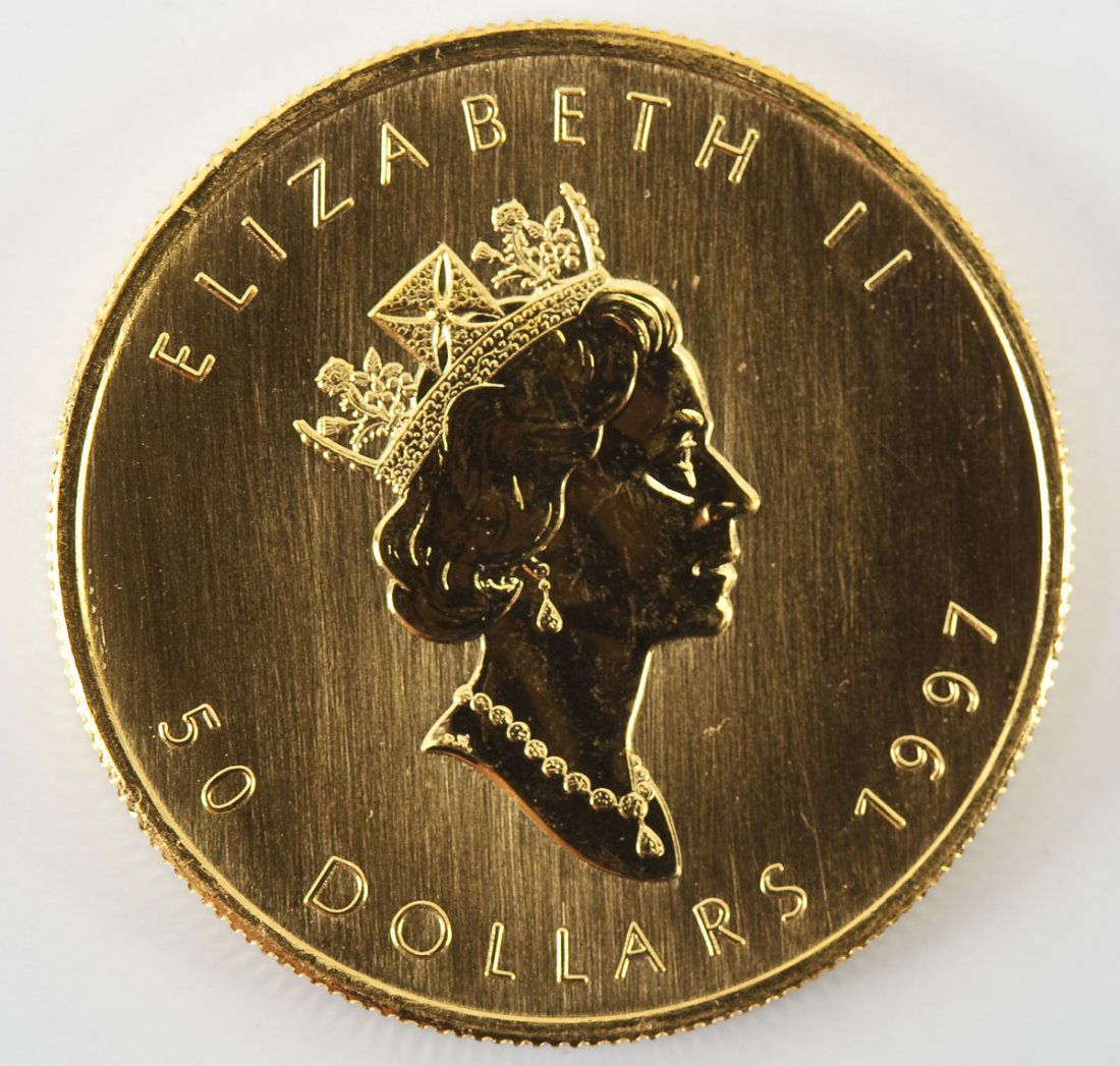1997 Canadian $50 1 Oz .9999 Gold Maple Leaf: DESCRIPTION: 1997 Canadian $50 one ounce .9999 fine gold Maple Leaf coin. CONDITION: Appears uncirculated.
