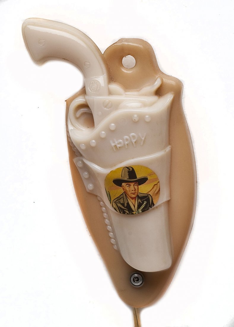 Hopalong Cassidy Milk Glass Night Light: DESCRIPTION: Hopalong Cassidy milk glass night light in the shape of a pistol and holster. Marked to back "Aladdin © William Boyd, Ltd. Pat. App. For". MEASUREMENTS: 10". CONDITION: No defects noted.