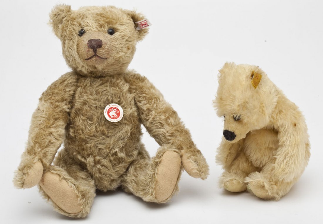 2 Contemporary Steiff Bears: DESCRIPTION: Two contemporary Steiff mohair bears. Includes a 10" white sitting polar bear with script button and yellow ear tag with number "034756" and a 15" tan mohair Henry limited edition bear wi