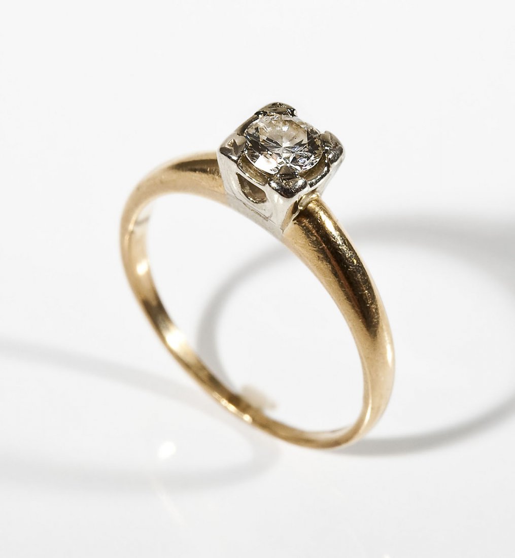 .40 Carat Diamond Solitaire Ring: DESCRIPTION: Diamond solitaire ring in tested 14K yellow and white gold. Set with one approximately 40 point diamond in an illusion setting. Clarity SI, color G-H. MEASUREMENTS: Size 5-1/4. 1.3 dwt (2