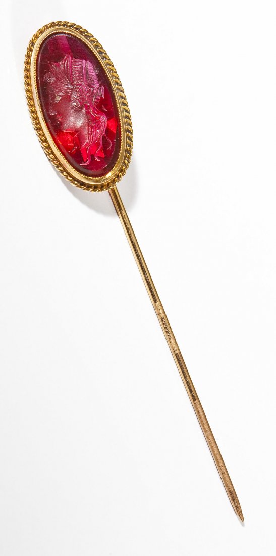 10K Intaglio Stickpin: DESCRIPTION: Stickpin in stamped 10K gold with oval red gemstone intaglio cut with portrait of a lady. MEASUREMENTS: 2-1/4" long. 1.1 dwt (1.8 gr). CONDITION: No defects noted.