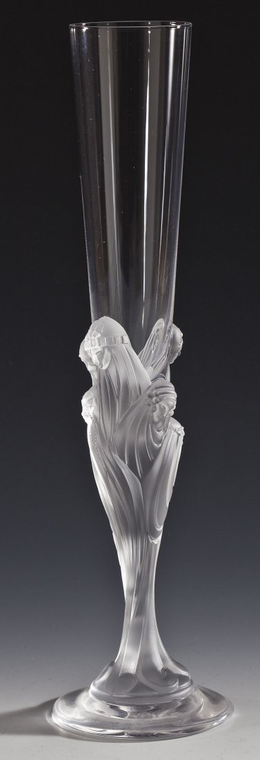 Erte France Champagne Flute: DESCRIPTION: Erte France champagne flute. Molded stem with faces of seven woman. Marked underneath "Erte France". With original blue box. MEASUREMENTS: 3-1/8" diameter x 11-3/4" high. CONDITION: No de