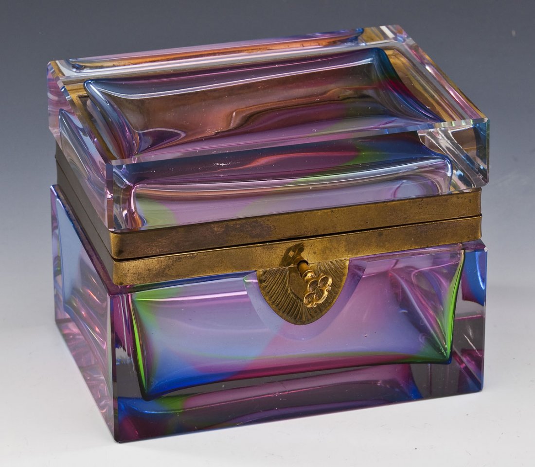 Rainbow Glass and Brass Dresser Box: DESCRIPTION: Rainbow glass and brass dresser box with key. PROVENANCE: From Eleanor Allen and the late Heath Allen, Camp Hill, PA. MEASUREMENTS: 5-5/8" x 4-1/8" x 4-3/8" high. CONDITION: Light surface