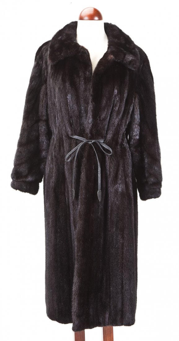 Full Length Black Mink Coat with Belt: DESCRIPTION: Full length black mink coat with belt. Monogrammed on interior "LGS". Thin leather belt appears on either side of the jacket. Hook closures. MEASUREMENTS: Size approximately 8/10. Sleeve