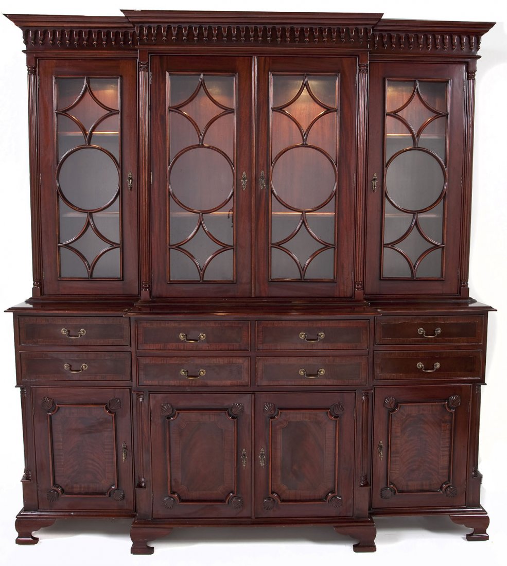 Large English Georgian Revival China Cabinet: DESCRIPTION: A large and elaborate English Georgian Revival china cabinet in the mixed Gothic/Chinese taste. The form consisting of an electrified double door with side windows. The top surmounted by 