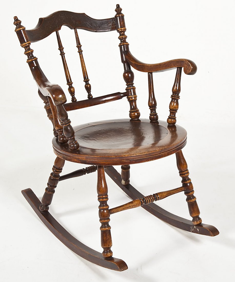 Colonial Revival Rocker: DESCRIPTION: Colonial Revival rocker. MEASUREMENTS: 19" diameter x 33" high at back. CONDITION: Wear consistent with age.
