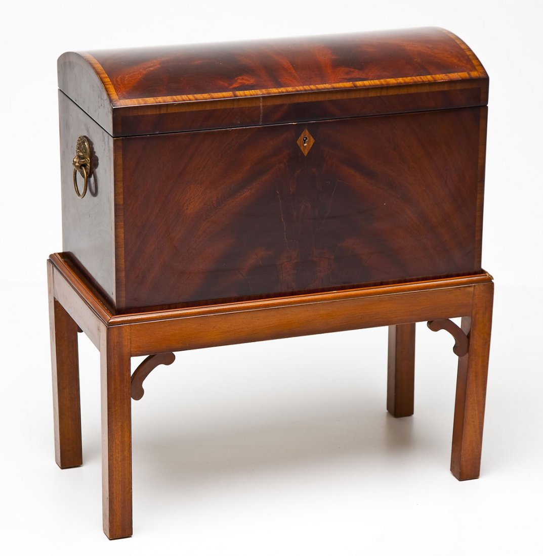 Box on Frame: DESCRIPTION: 18th century style box on frame. Possibly a modern interpretation of a bottle box. Banded mahogany box with inlaid escutcheon. PROVENANCE: From the Estate of Ron Shepler, Harrisburg, PA. 