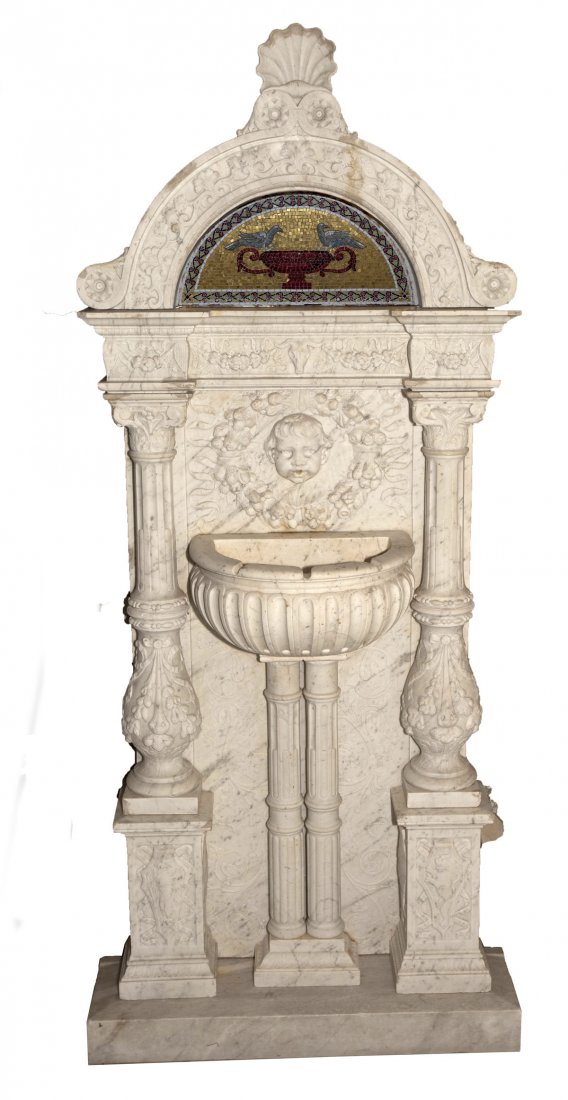 Florentine Style Marble & Mosaic Garden Fountain: DESCRIPTION: White marble garden wall fountain with mosaic frieze and cherub-faced spout encircled by Della Robbia style wreath. PROVENANCE: Purchased by consignor at auction of a Philadelphia "Main L