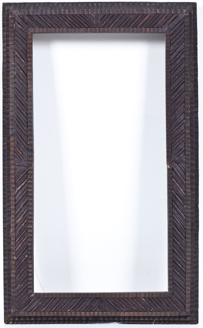 Tramp Art Chip Carved Frame: DESCRIPTION: Tramp art frame. Chip carved. Three tiers, main border with diagonal carving. MEASUREMENTS: Opening 13-1/2" x 26-1/4". Overall 19-7/8" x 32-7/8". CONDITION: Chipping and small losses, wea