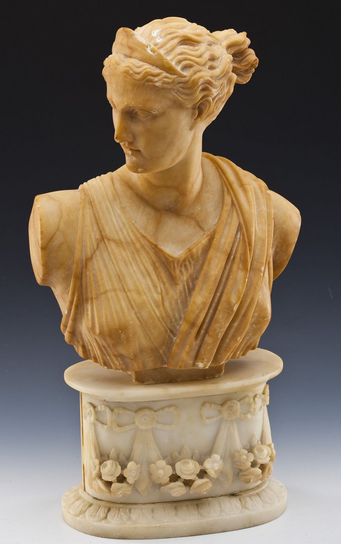 Alabaster Bust with Base: DESCRIPTION: Alabaster bust of classical draped woman. Base by association. 19th century. Unsigned. PROVENANCE: From the Estate of Ron Shepler, Harrisburg, PA. MEASUREMENTS: 20" high. CONDITION: Repai
