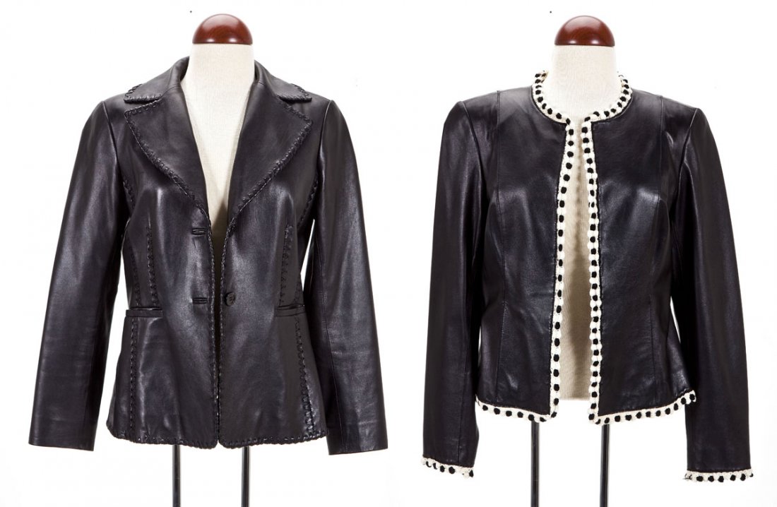 2 Doncaster Black Leather Jackets: DESCRIPTION: Two women's Doncaster black leather jackets. Includes: 1) Jacket with stitched edging. Size 6. 2) Jacket with black and white crocheted edging. Size 8. MEASUREMENTS: See Description. COND