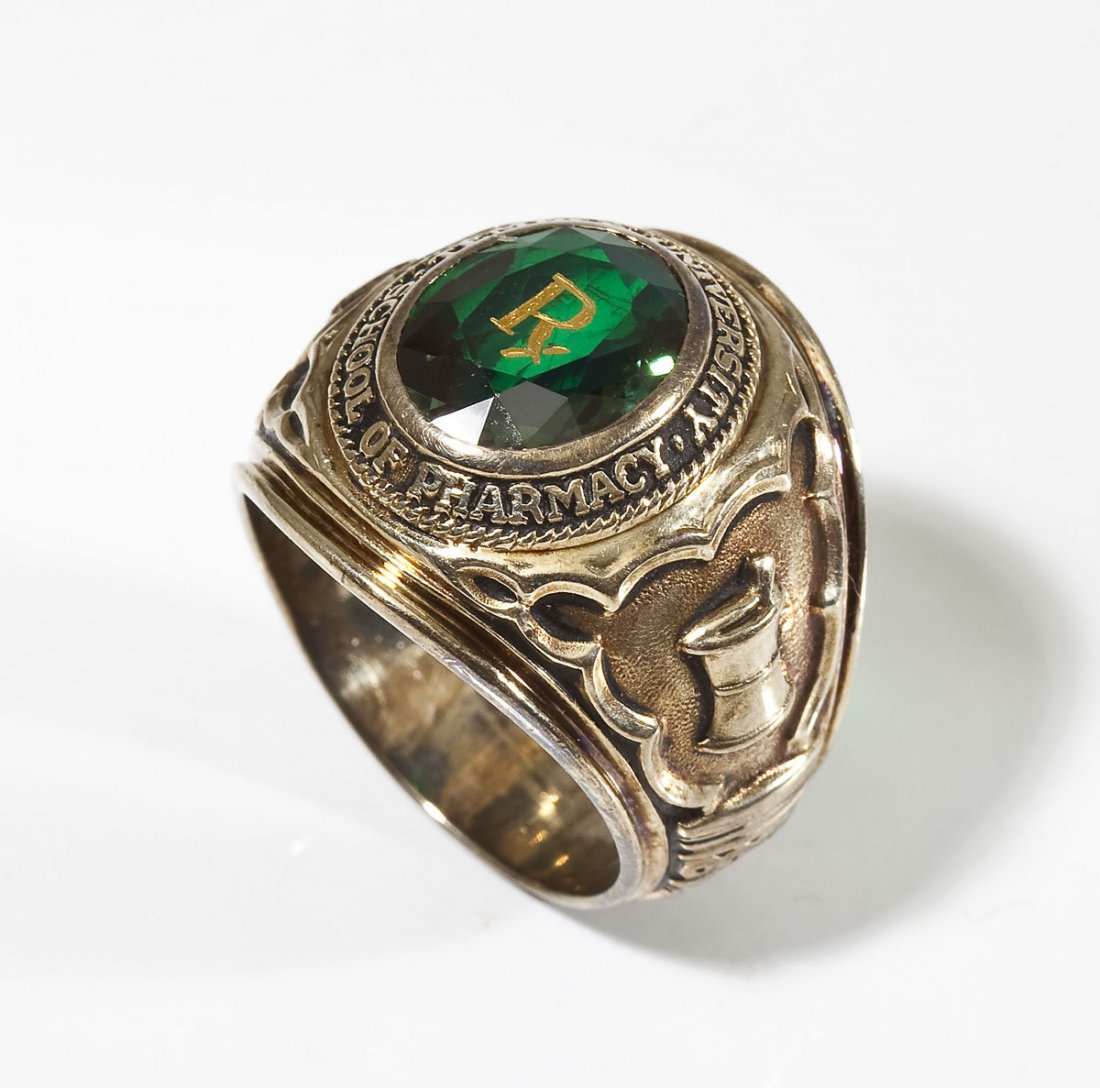 10K Temple Univ School of Pharmacy Ring: DESCRIPTION: Marked 10K yellow gold 1960 Temple University School of Pharmacy class ring with green stone. MEASUREMENTS: Size 9-3/4. 16.1 dwt (25.1 gr). CONDITION: No defects noted.