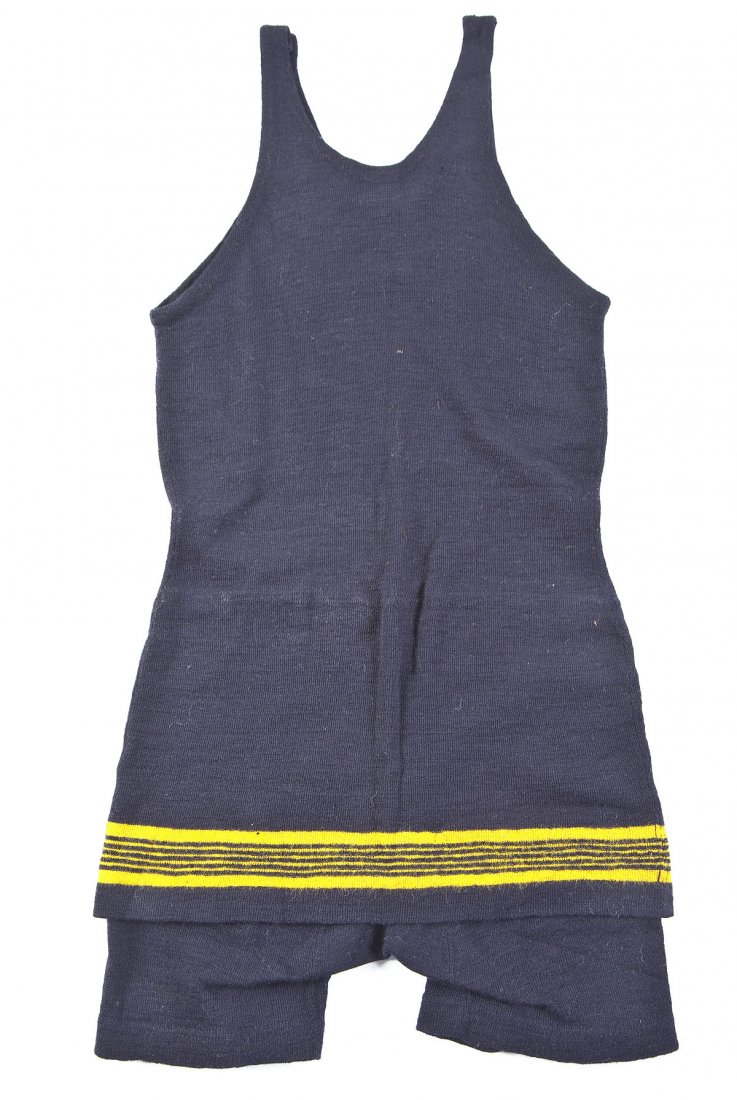 1920's Wool Jantzen Bathing Suit: DESCRIPTION: Jantzen bathing suit of navy and yellow wool. Button closure to left shoulder strap. Circa 1920's. MEASUREMENTS: 33" long overall. CONDITION: Excellent overall with one 1/8" hole to back
