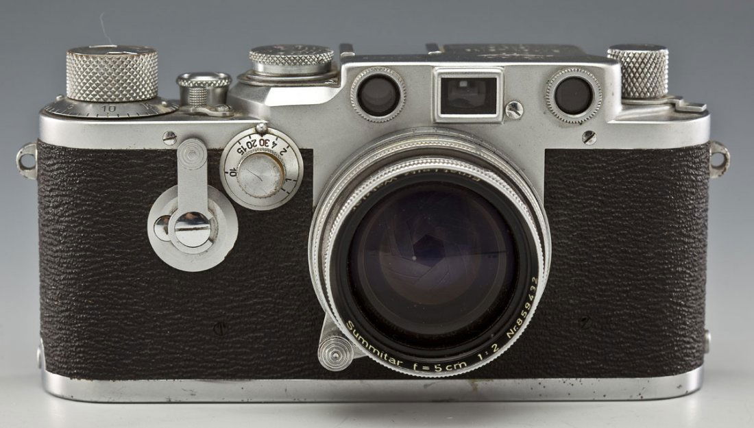 Leica D.R.P. IIIc Camera: DESCRIPTION: Leica D.R.P. IIIc camera. Ernst Leitz Wetzlar Germany. Marked "No. 480579". Lens marked "Summitar f=5cm 1:2 Nr. 859432". With lens cap. MEASUREMENTS: 5-1/4" x 2-1/4" x 2-3/4" high. CONDIT