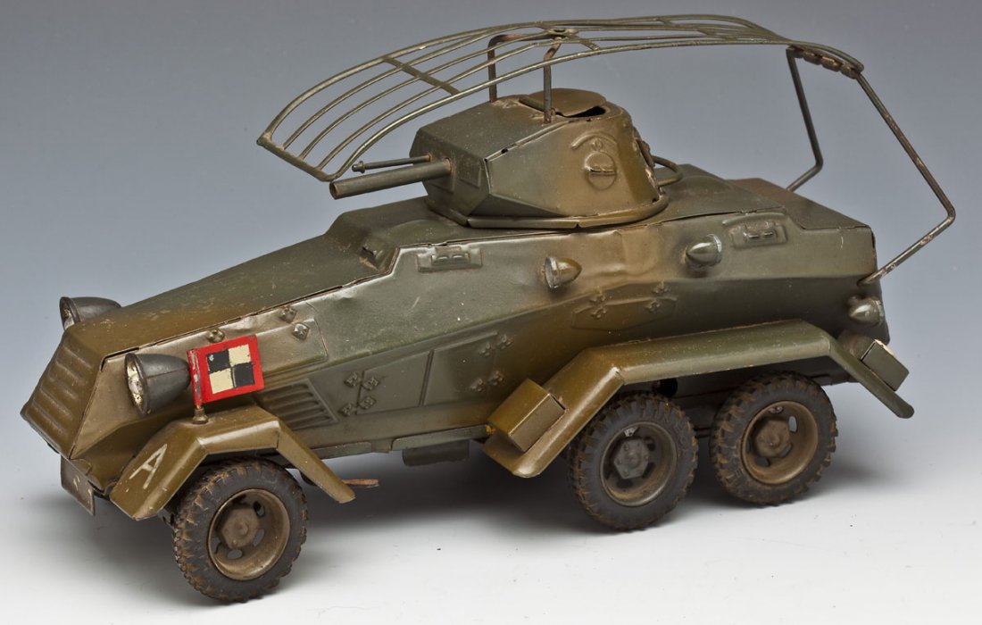Lineol Tinplate German Armoured Car: DESCRIPTION: Lineol tinplate Armoured Car (Panzerspaehwagen), complete with flag, electrified headlights and battery compartment underneath chassis. Rubber tires and antenna are original. No firing me
