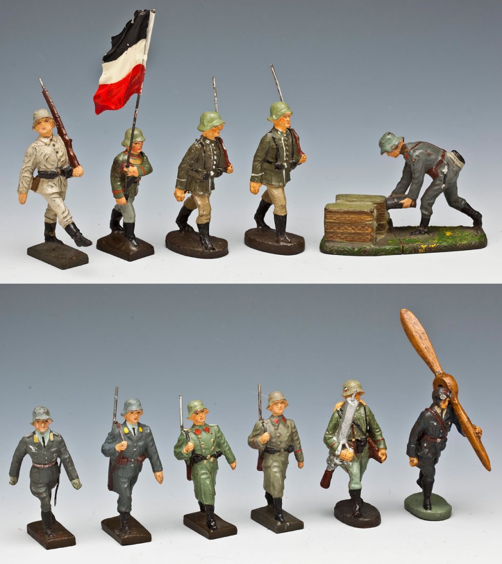 11 Elastolin & Lineol German Toy Soldiers: DESCRIPTION: Elastolin and Lineol German Composition lot of eleven German toy soldiers, mainly Luftwaffe and Wehrmacht marching. Includes rare Lineol recruit goosestepping, Lineol Flak operator fetchi