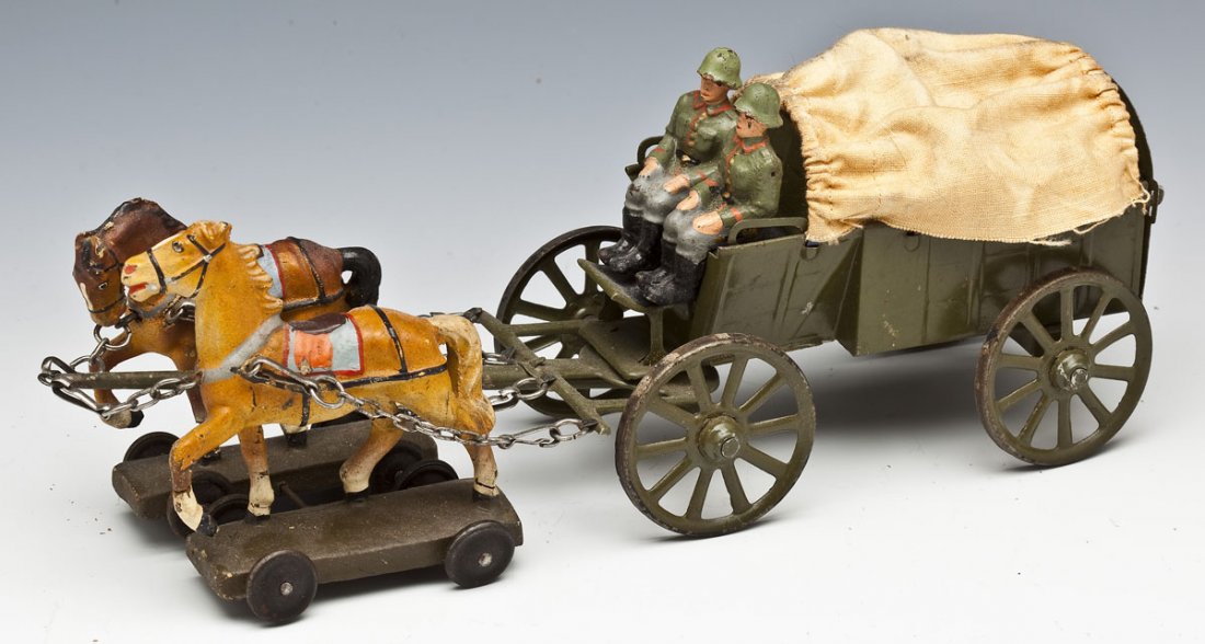Lineol German Military Supply Wagon in OB: DESCRIPTION: Lineol German Military Supply Wagon (Plannwagen) with horse team and in original box. 6.5 cm scale, wagon is tin with cloth top, toy soldier drivers and horses are composition. Made in 19