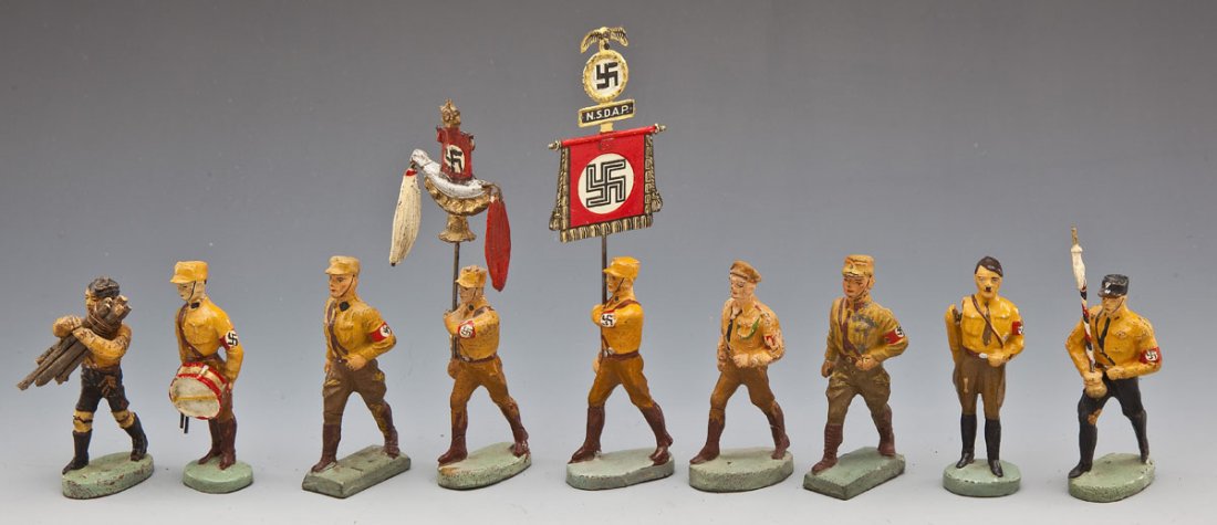 Lineol and Elastolin SA and Political Group: DESCRIPTION: Nine "brownshirt" pieces, all 7.0 cm scale, including Elastolin Hitler with moveable arm, Elastolin Standard Bearer (repro standard), Elastolin SA band leader and standard-bearer, rare dr