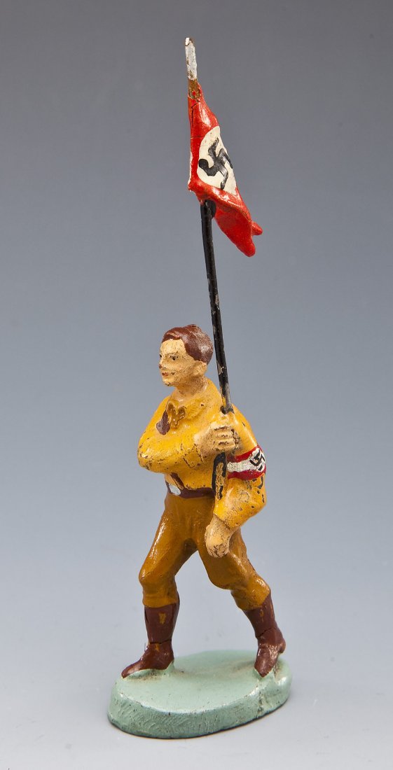 Elastolin German Political Youth with Pennant: DESCRIPTION: One marching Hitler Youth with small pennant (wimpeltraeger). Mid-1930's Germany, prewar. MEASUREMENTS: 7.0 cm scale. CONDITION: Very Good original condition with some slight composition 