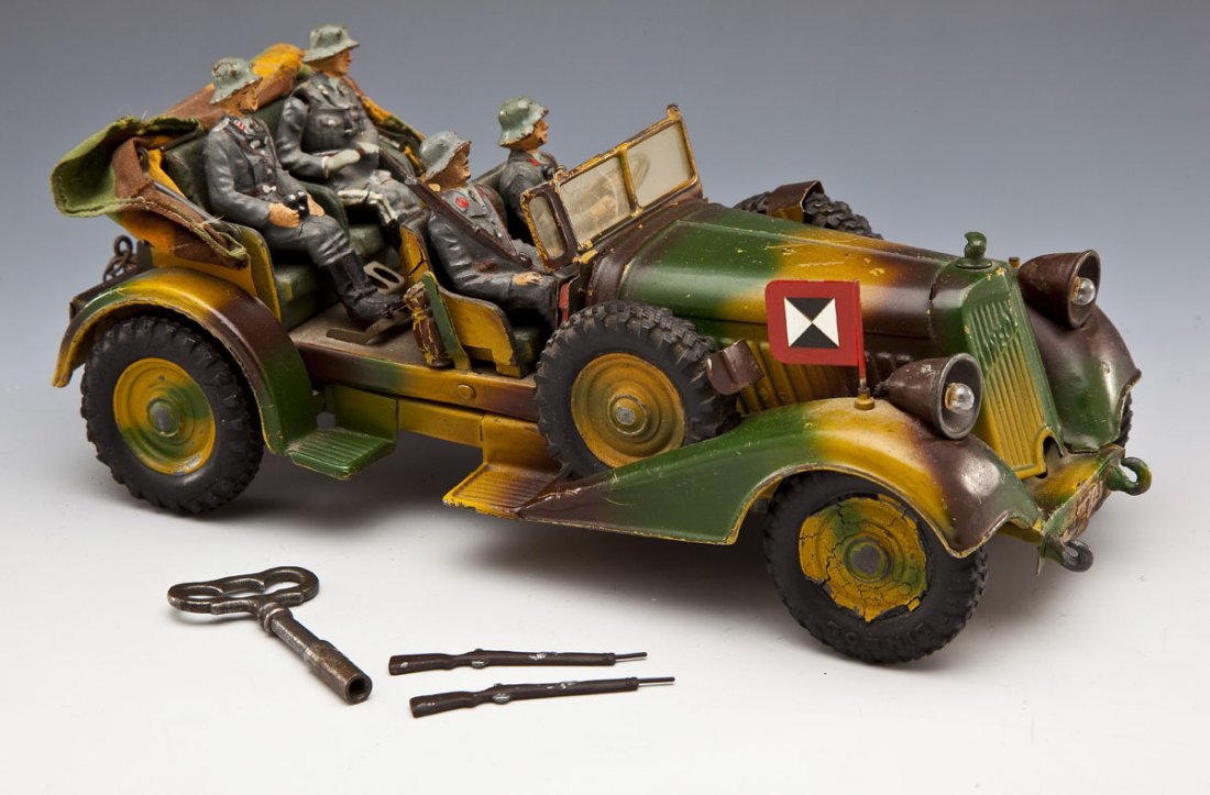 Lineol Staff Car (Kuebelwagen) with Luftwaffe Crew: DESCRIPTION: Lineol Kuebelwagen and four-man German Air Force crew, pressed lithographed tin with rubber tires, retractable cloth convertible top (latching bar missing for front), electrified headligh