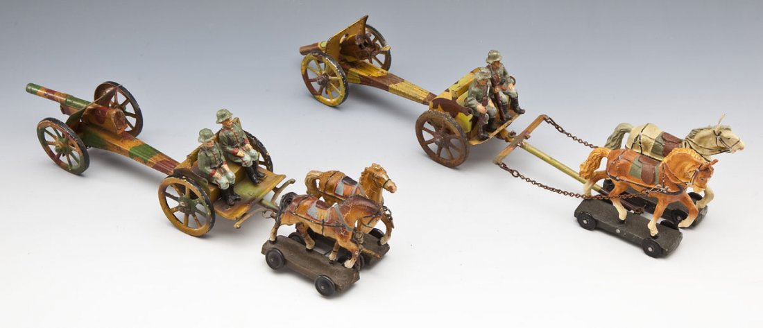 2 Lineol and Elastolin Horse-Drawn Artillery: DESCRIPTION: One Lineol and one Elastolin horse-drawn artillery units. Limbers and cannons pressed lithographed tin. Soldiers and horses made of composition material. Lineol team consists of 7.0 scale