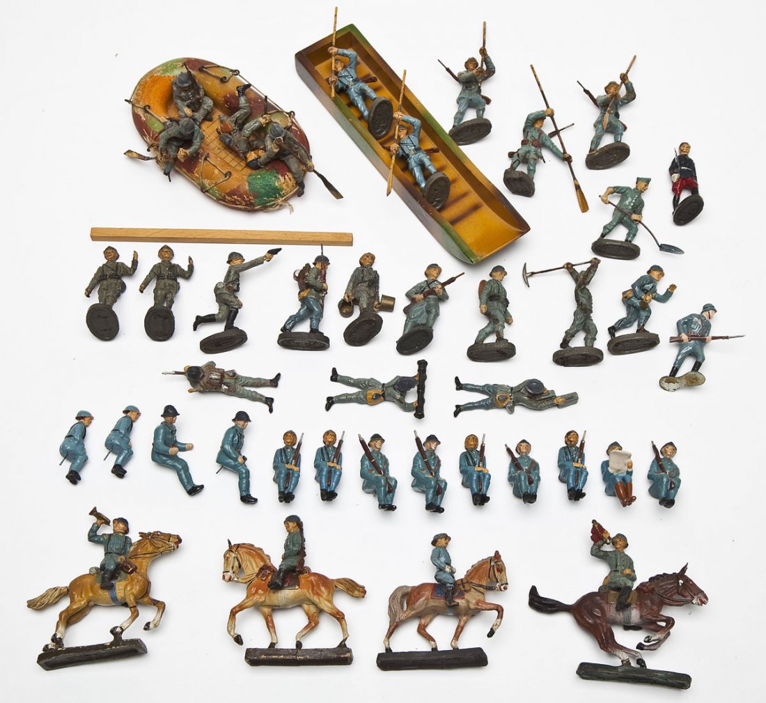 Elastolin and Lineol French Army in Action: DESCRIPTION: Forty-seven pieces Elastolin and Lineol French Army including scarce rubber assault raft (rowers exhibit considerable cracking and some composition lost). Also includes: two men carrying 