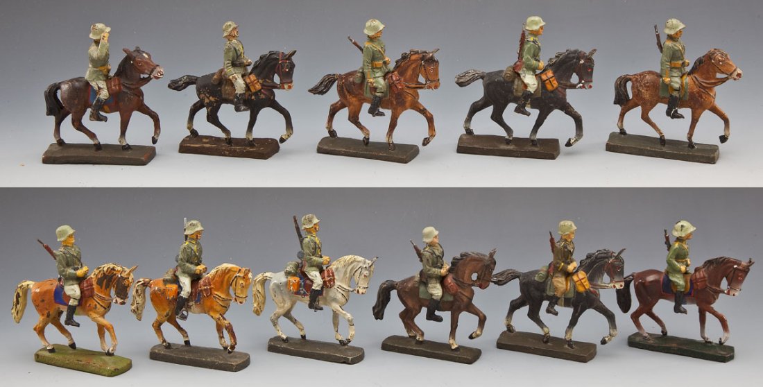 Lineol and Elastolin German Army Cavalry Group: DESCRIPTION: Twenty-two horses and riders representing the German Reitersturm (Cavalry). Various poses, including scarce Elastolin troopers with separate carbines (one repro carbine) and saluting offi