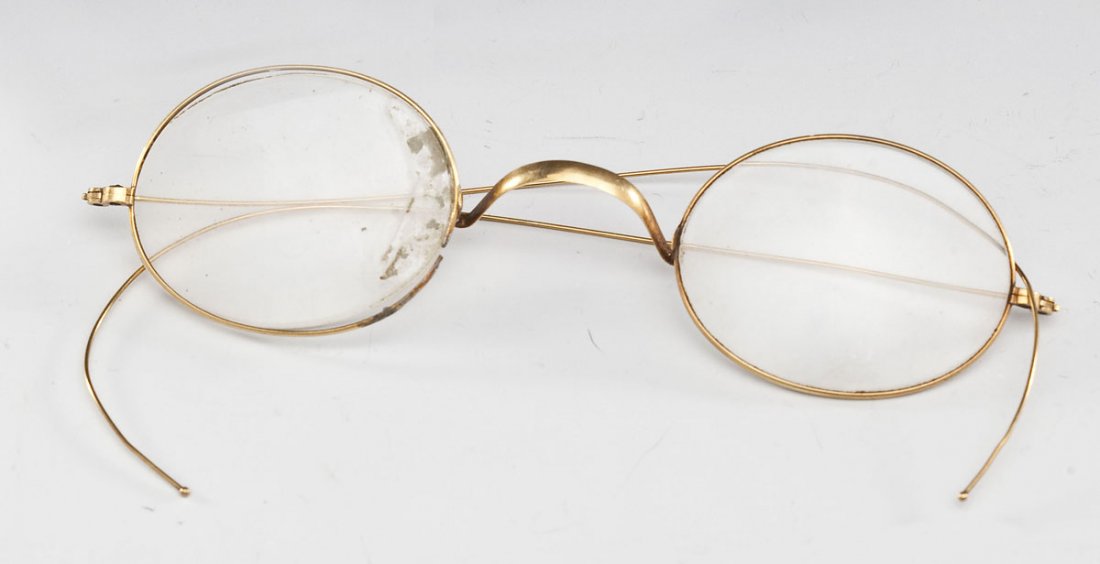 Pair 14K Eyeglasses: DESCRIPTION: A pair of marked 14K yellow gold eyeglasses. MEASUREMENTS: 2.87 dwt (4.3 gr) without lenses. CONDITION: One frame split.