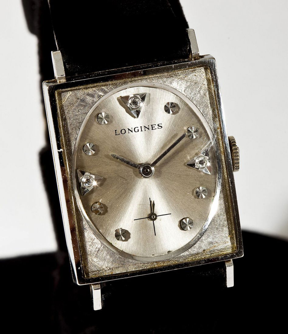 14K White Gold Longines Wristwatch: DESCRIPTION: Longines wristwatch. Marked 14K white gold case. Silvered dial with diamond markers at 12, 3 and 6 and subsidiary seconds. 17 jewel movement. Inside case marked "Longines-Wittnauer Star W