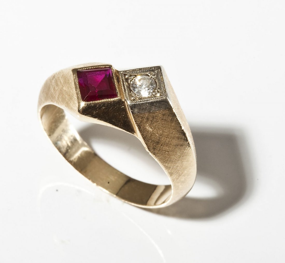 Man's 10K Diamond & Ruby Ring: DESCRIPTION: Tested 10K ring set with one approximately 15 point round diamond and one square simulated ruby. MEASUREMENTS: Size 11. 3.8 dwt (6 gr). CONDITION: No defects noted.