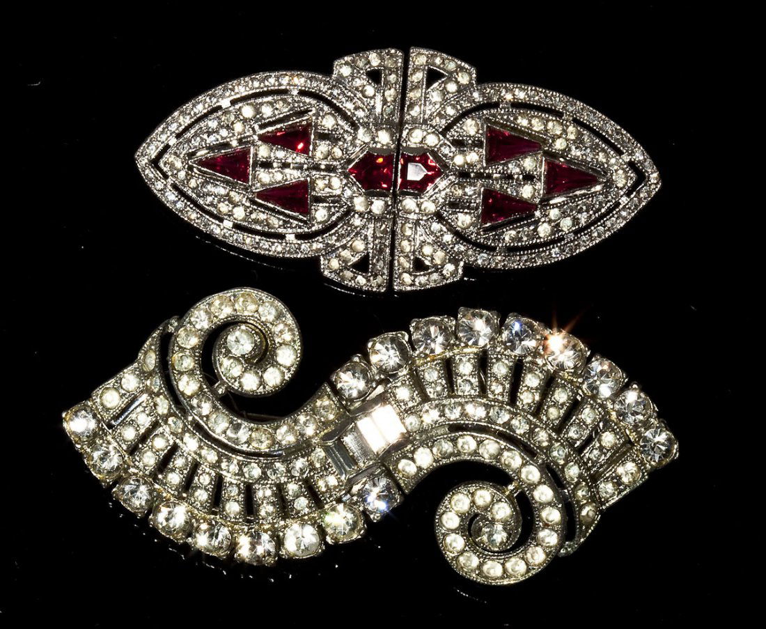 2 Coro Duette Brooches: DESCRIPTION: Two signed Coro Duettes. Includes: 1) Scroll shape brooch with round and baguette crystal rhinestones. 2-3/4" long 2) Marquise shape with red and crystal rhinestones. 2-3/8" long. MEASURE