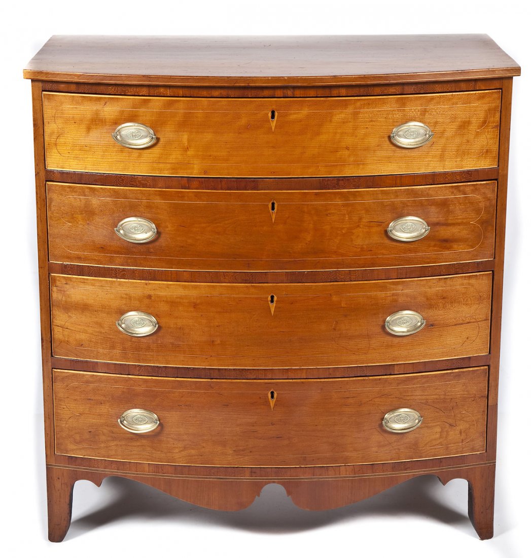 Hepplewhite Bow Front Chest of Drawers: DESCRIPTION: An American Hepplewhite bow-front chest of drawers, circa 1790-1800. The form consisting of a bow-front case resting on tall French bracket feet housing four conforming drawers separated 