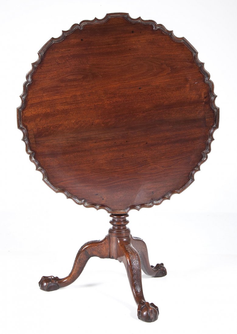 Chippendale Pie Crust Top Tea Table: DESCRIPTION: A Pennsylvania Chippendale mahogany pie crust top tea table, probably Philadelphia, circa 1760-80. The tripod base consisting of three carved legs with ball and claw feet and anthemion ca