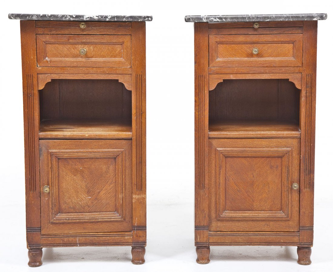 Pair of Continental Wash Stands: DESCRIPTION: Pair of wash stands. Oak cabinets with marble tops. Continental. MEASUREMENTS: 17" x 15" tops x 32" high. CONDITION: Wear and finish consistent with age.