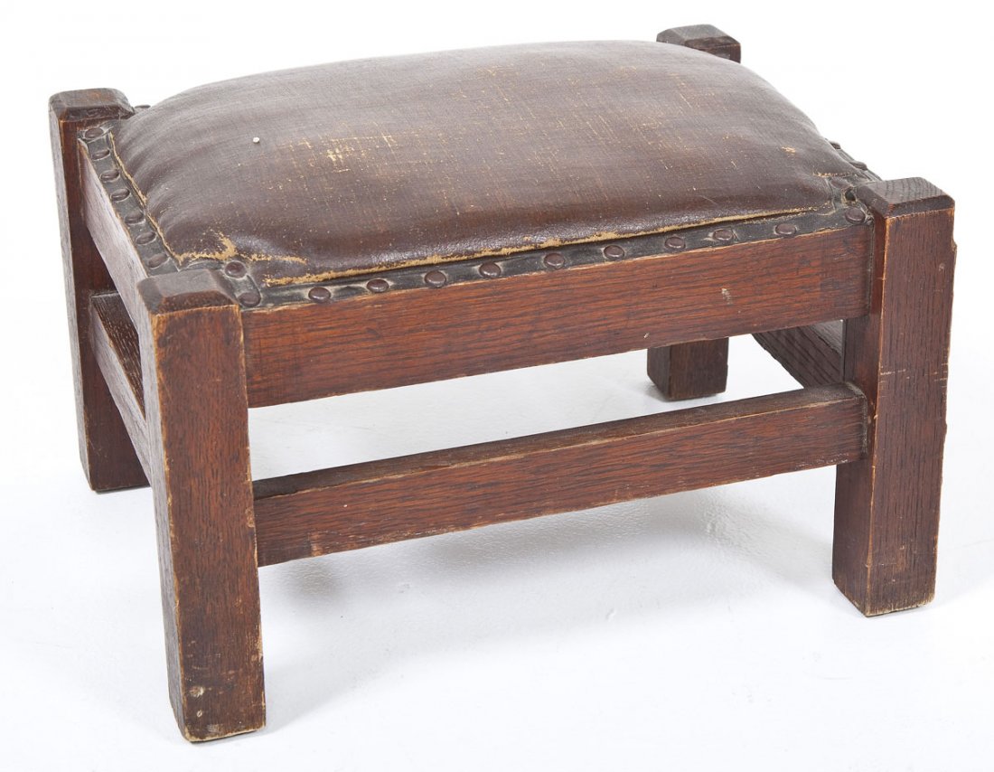 Arts & Crafts Footstool: DESCRIPTION: Arts & Crafts footstool. Oak with oil cloth upholstery. Circa 1900. MEASUREMENTS: 16" x 12" x 10" high. CONDITION: Wear consistent with age.