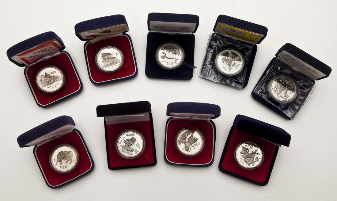 9 Chinese Zodiac 10 Yuan Silver Coins: DESCRIPTION: Nine Chinese zodiac 10 yuan 90% silver coins. Each housed in original case with COA unless otherwise noted. Includes: 1983 pig, 1984 rat, 1986 bull (no COA), 1986 tiger (no COA), 1987 rab