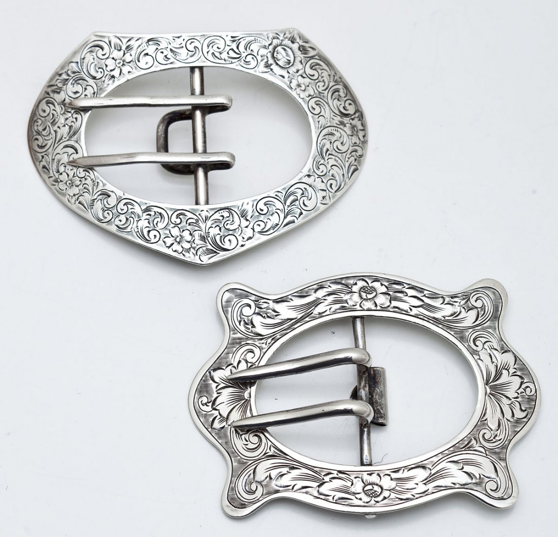 2 Edwardian Sterling Buckles: DESCRIPTION: Two marked sterling silver Edwardian buckles with overall scrolled design. MEASUREMENTS: Each 3-1/8" long. CONDITION: Minor wear as expected with age and use.