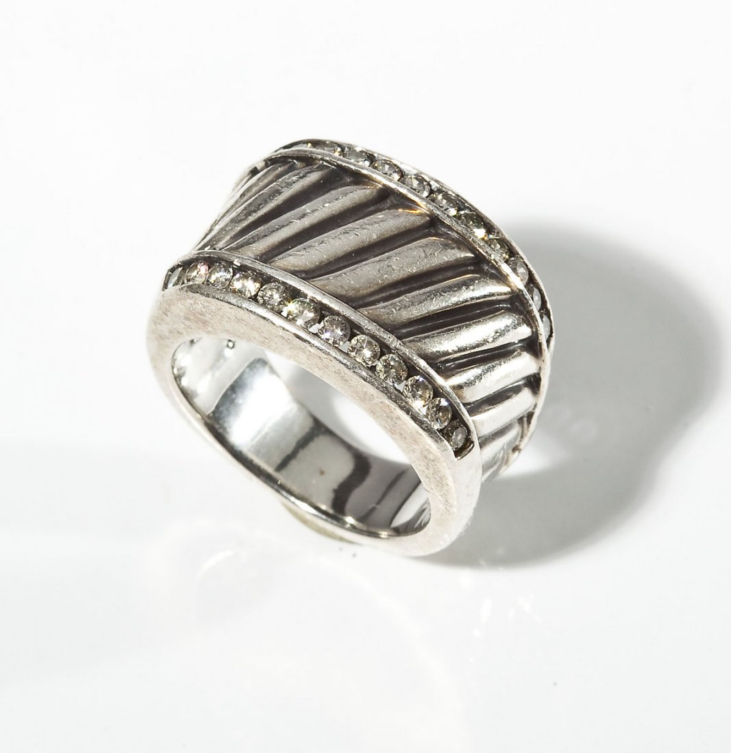 David Yurman Sterling Ring with Diamonds: DESCRIPTION: Marked 925 D.Y. cigar cable classic ring with two rows of diamonds. Approximately .75 ctw. Includes bag. MEASUREMENTS: Size 6. 6.3 dwt (9.8 gr). CONDITION: Light wear.