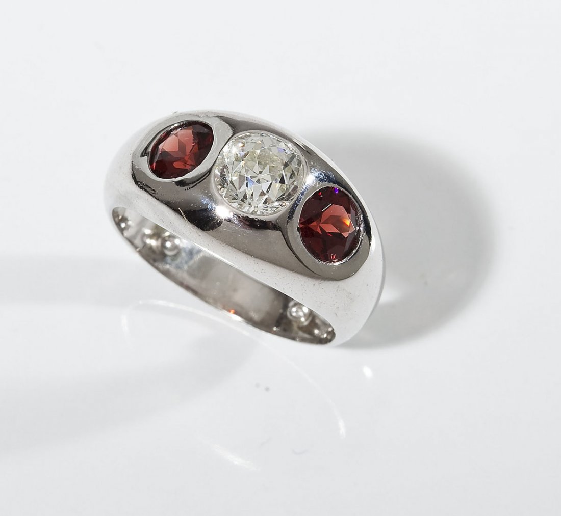 Man's 1.22 Carat Diamond & Garnet Ring: DESCRIPTION: Man's marked 14K white gold ring. Set with one approximately 1.22 carat Old European cut diamond. Clarity VS1, color F. Also set with two 5.5mm round faceted garnets. MEASUREMENTS: Size 7