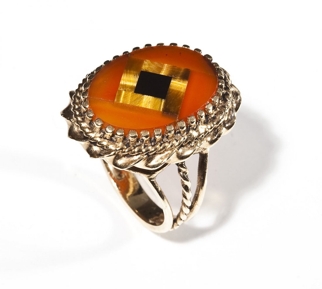 10K Mosaic Gemstone Ring: DESCRIPTION: Tested 10K yellow gold ring set with an inlaid mosaic of onyx, tiger's eye, and carnelian. MEASUREMENTS: Size 7-1/4. 4.4 dwt (6.9 gr). CONDITION: No defects noted.
