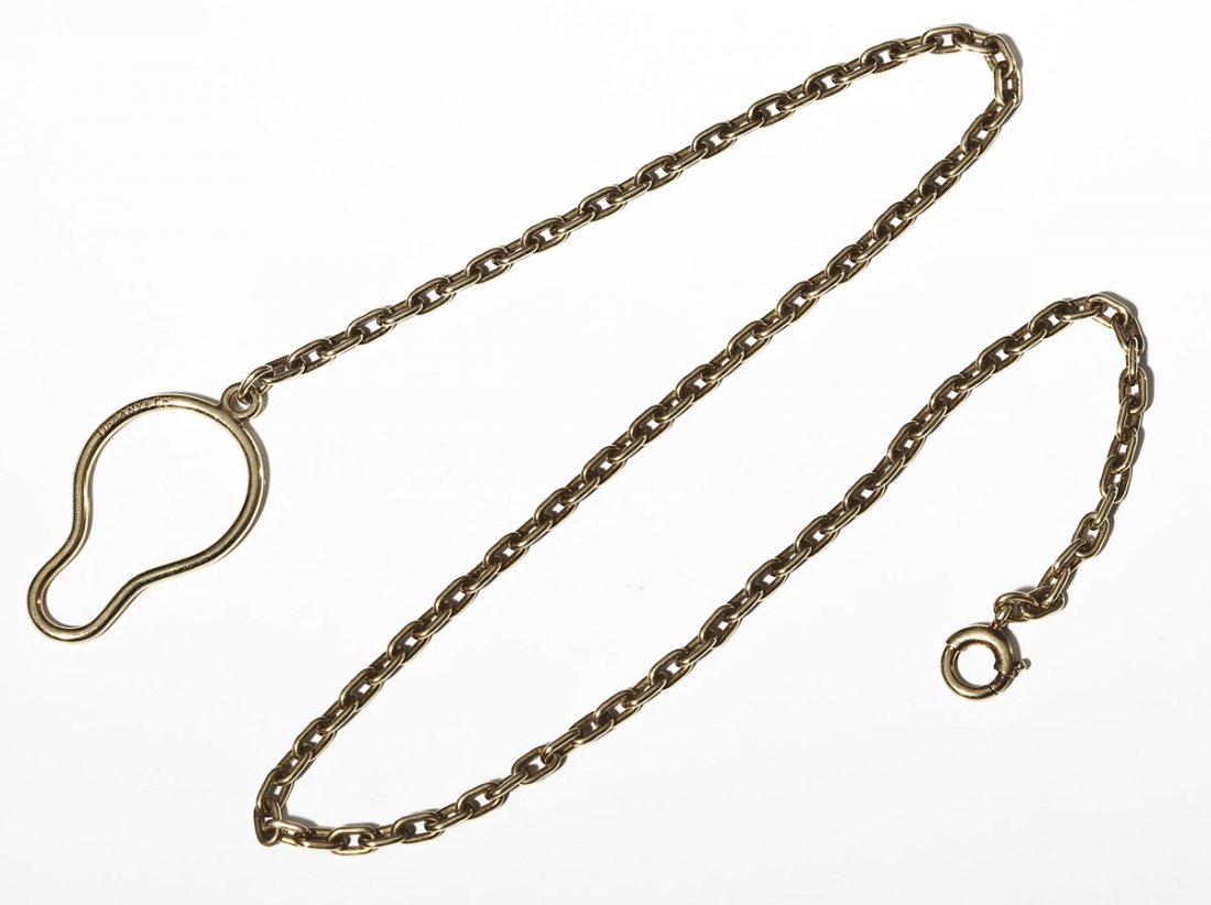 Tiffany & Co. 18K Gold Watch Chain: DESCRIPTION: Marked "Tiffany & Co." tested approximately 18K yellow gold watch chain with button ring fob. MEASUREMENTS: 13" long. 7.4 dwt (11.6gr). CONDITION: No defects noted.